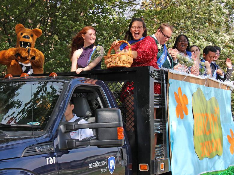 Homecoming court during the Homecoming Parade with the Nittany Lion